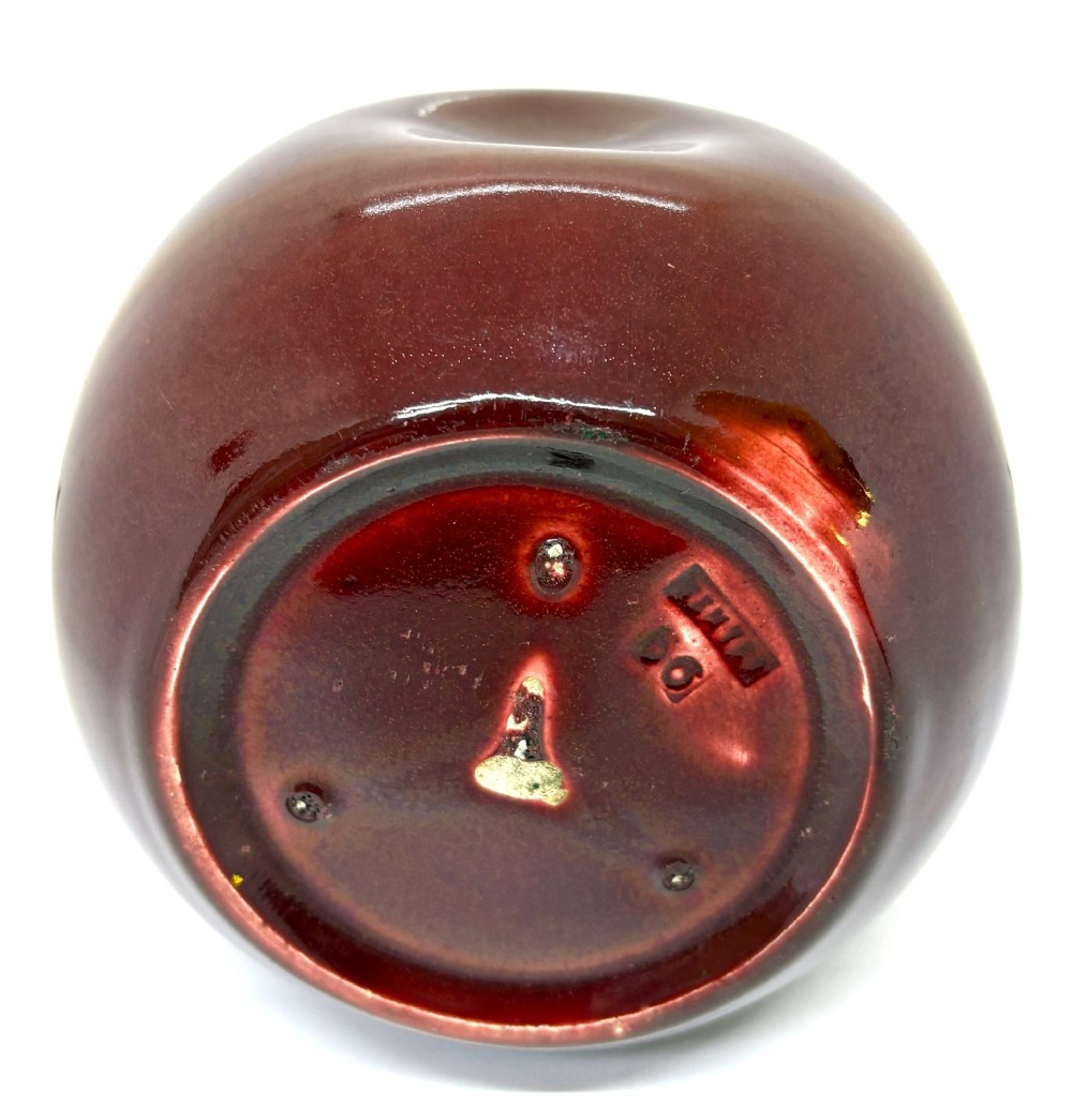 A bulbous ceramic vase with a glossy deep burgundy-brown glaze, indented dimples on the sides, and a short flared neck. View IV