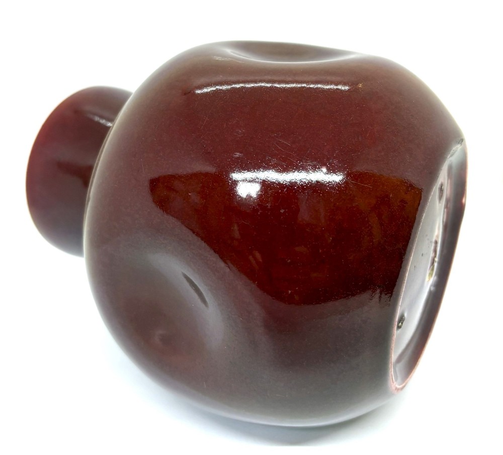 A bulbous ceramic vase with a glossy deep burgundy-brown glaze, indented dimples on the sides, and a short flared neck. View V