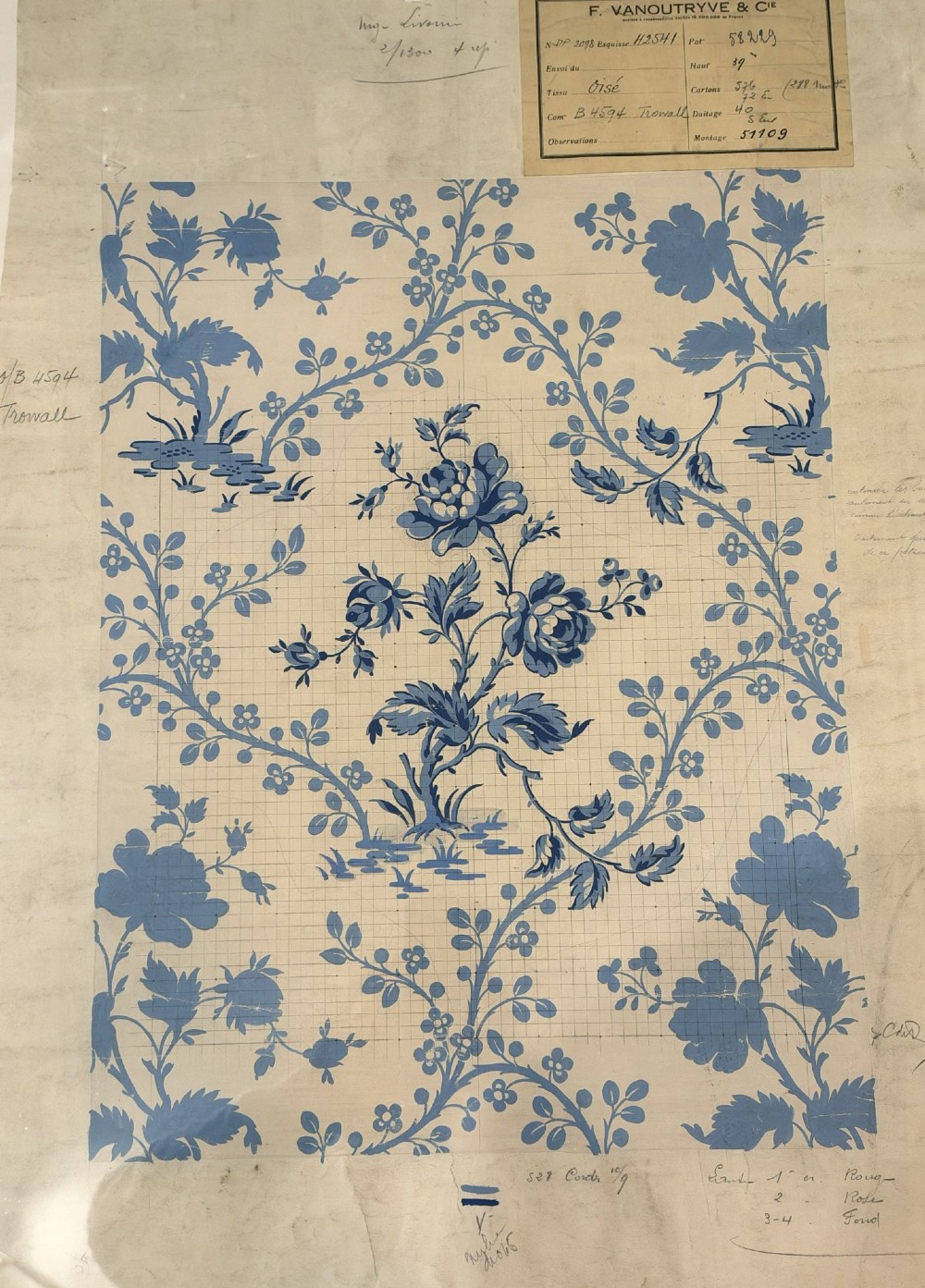 A framed vintage French textile design featuring a blue floral motif rendered on grid paper, complete with technical handwritten annotations and an original manufacturer label. View II