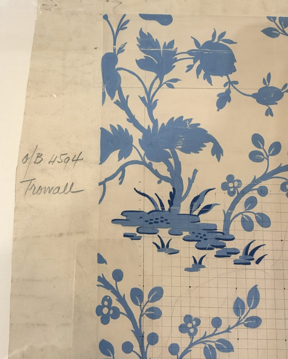 A framed vintage French textile design featuring a blue floral motif rendered on grid paper, complete with technical handwritten annotations and an original manufacturer label. View IV