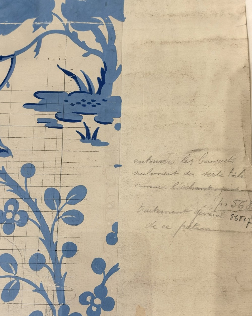 A framed vintage French textile design featuring a blue floral motif rendered on grid paper, complete with technical handwritten annotations and an original manufacturer label. View VI