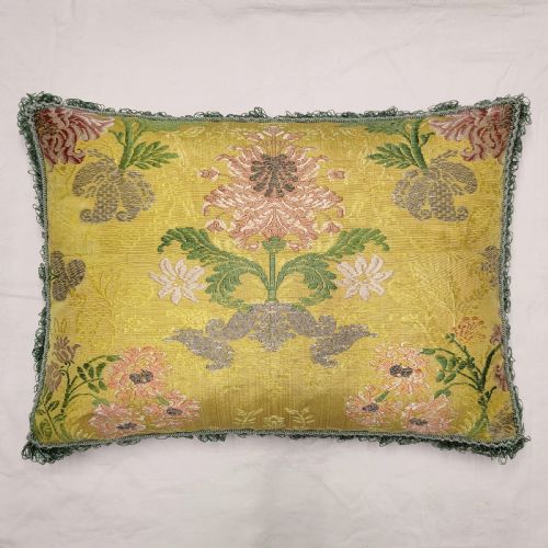 A CUSHION OF 18TH CENTURY FRENCH SILK