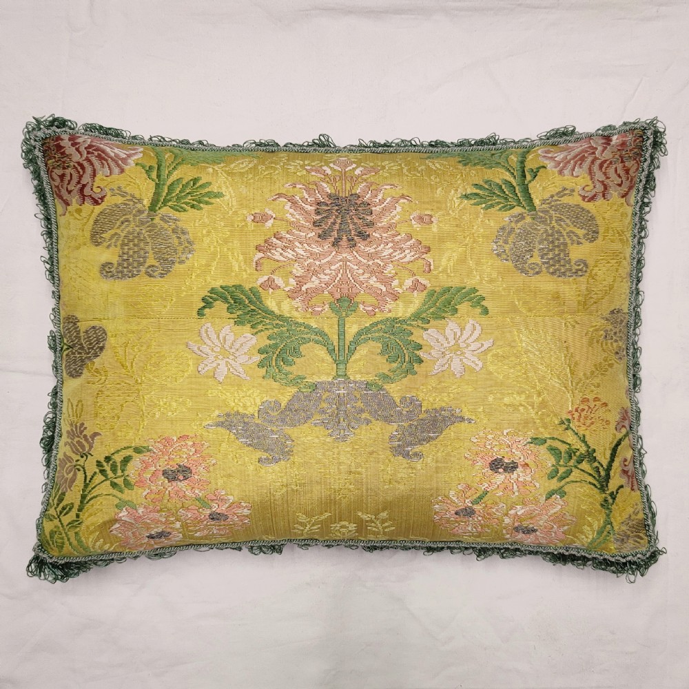 A cushion of 18th century French silk