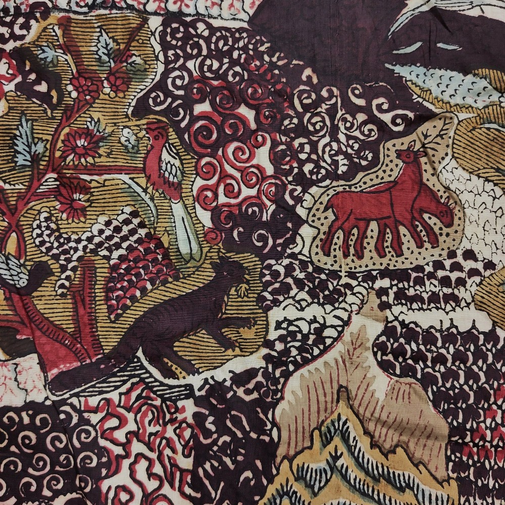 A rectangular 19th-century white cotton textile featuring a woodblock-printed tree of life design in red, green, and dark brown within an ornate floral border. View IV