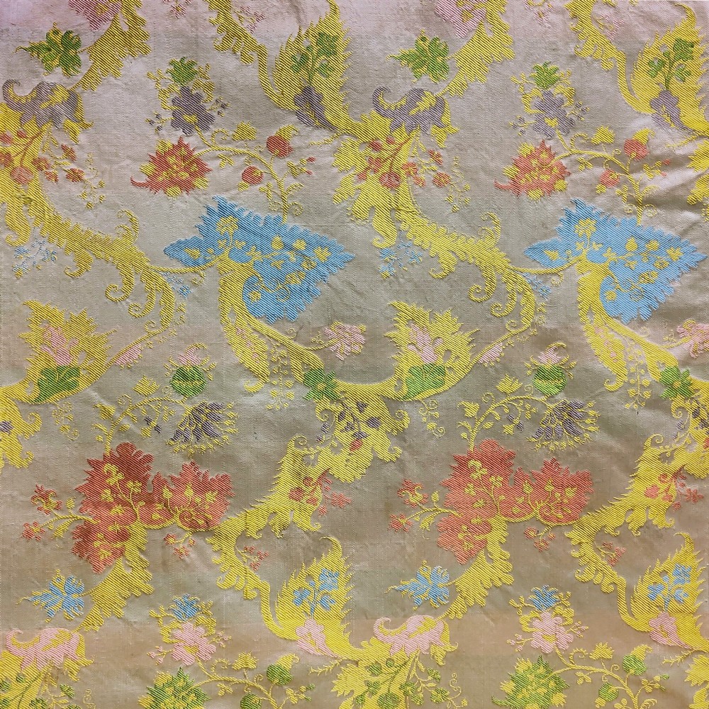 A rectangular length of 18th-century Spitalfields Bizarre silk lampas featuring colourful asymmetrical woven motifs on a muted ground. View III