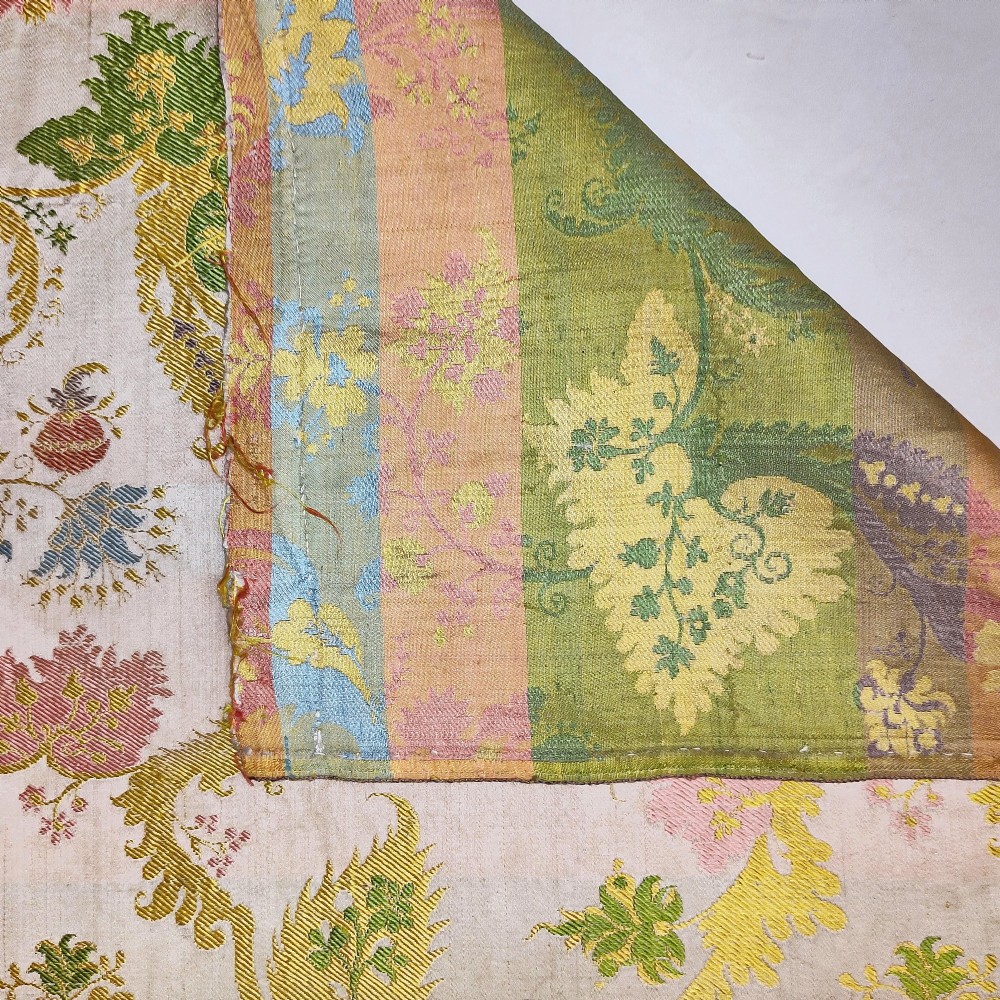A rectangular length of 18th-century Spitalfields Bizarre silk lampas featuring colourful asymmetrical woven motifs on a muted ground. View IV