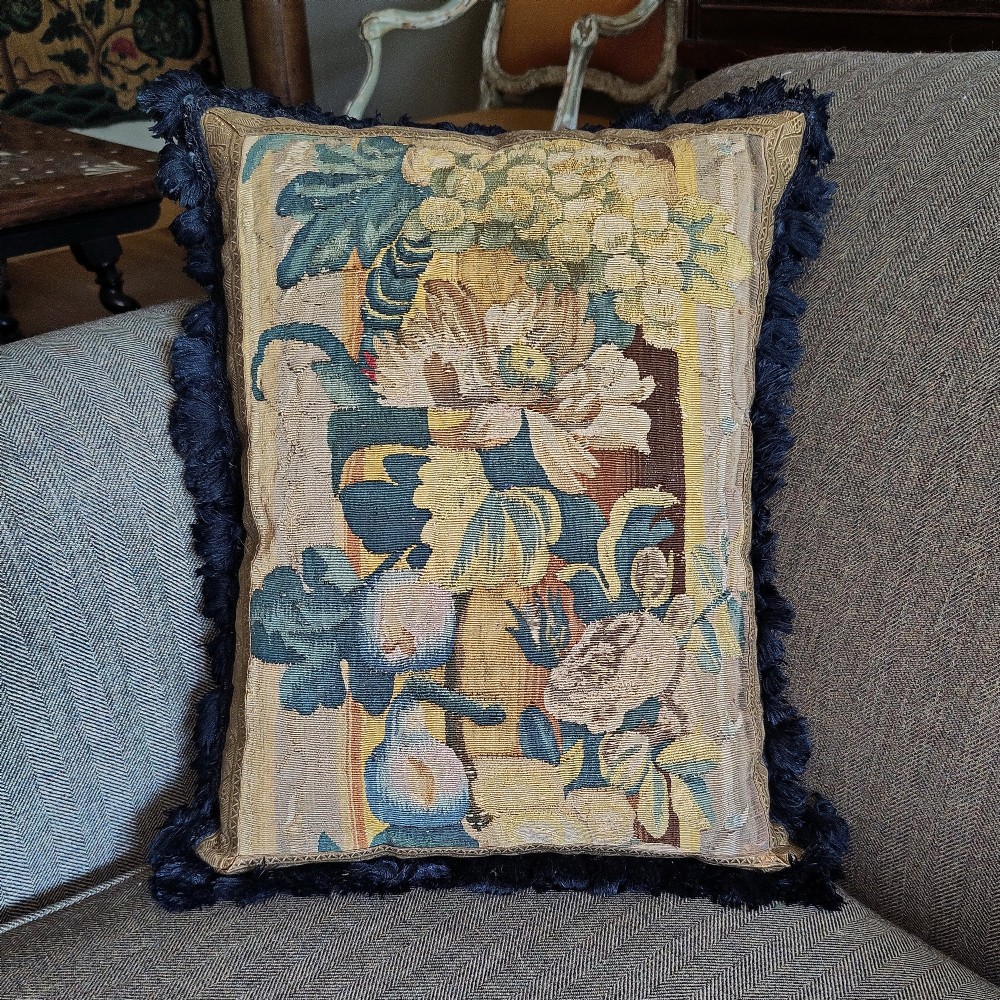 A cushion of 17th century Flemish tapestry border