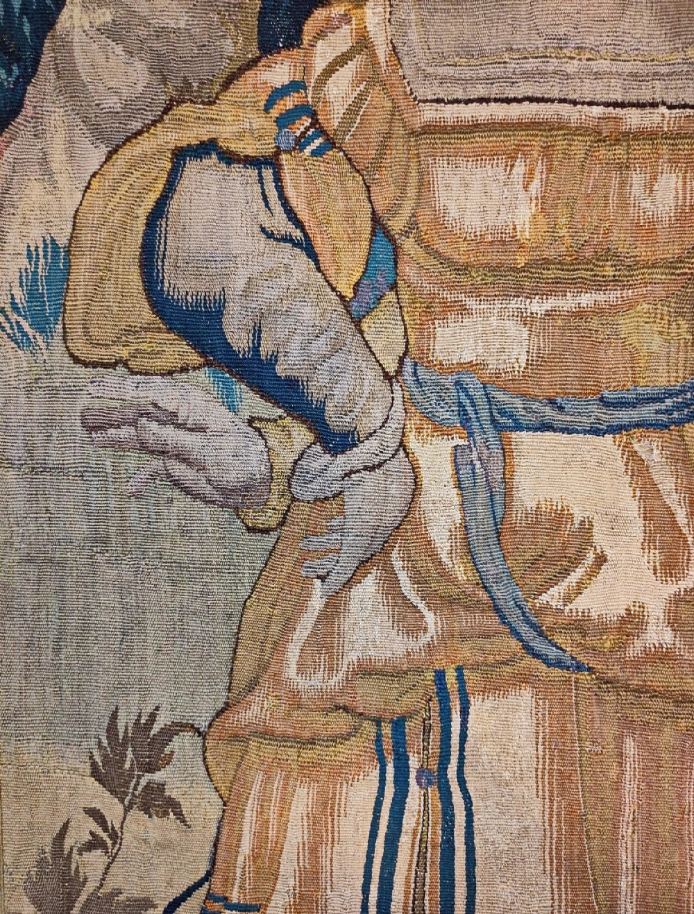 A tall rectangular Flemish tapestry panel depicting a woman and man in Renaissance attire standing in a wooded landscape. View III