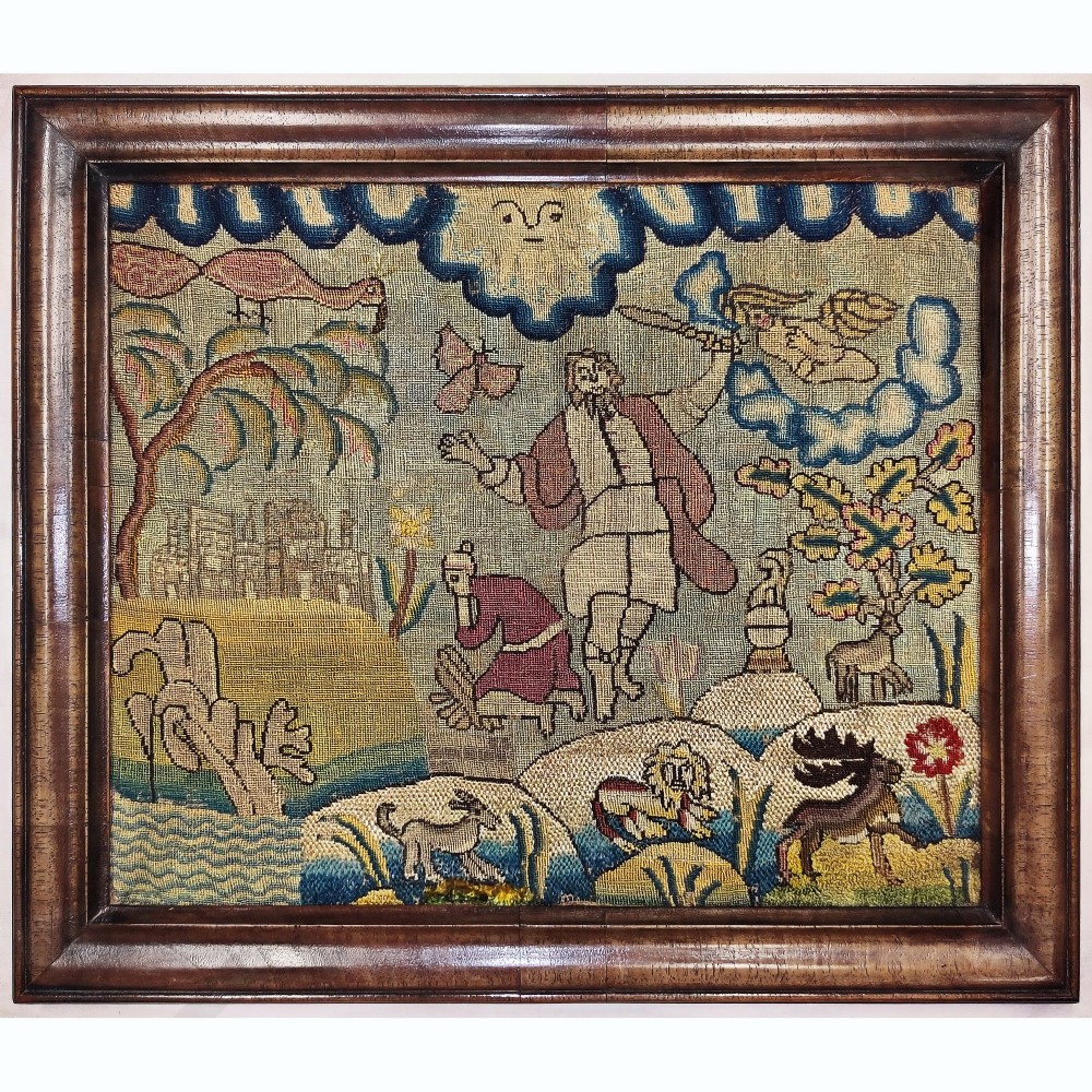 A framed 17th-century style English needlework picture featuring figures, animals, and foliage stitched in silk and wool threads inside a dark moulded timber frame.