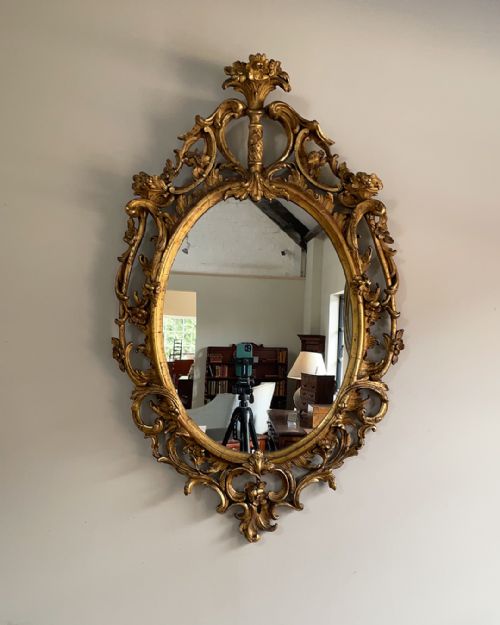 giltwood and composition rococo style oval wall mirror - CATEGORY: ANTIQUE MIRRORS - DATED 18TH CENTURY