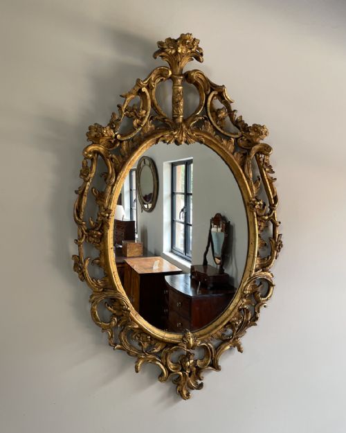 GILTWOOD AND COMPOSITION ROCOCO STYLE OVAL WALL MIRROR - ADDITIONAL PHOTO 1