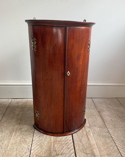 small bowfronted mahogany corner cupboard - CATEGORY: ANTIQUE CUPBOARDS - DATED 19TH CENTURY