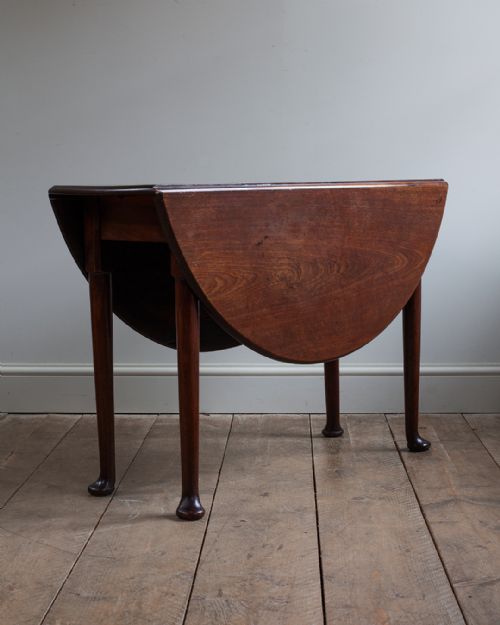 GEORGIAN MAHOGANY OVAL DROP LEAF DINING TABLE