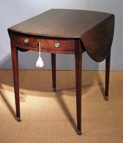 George III mahogany oval Pembroke table