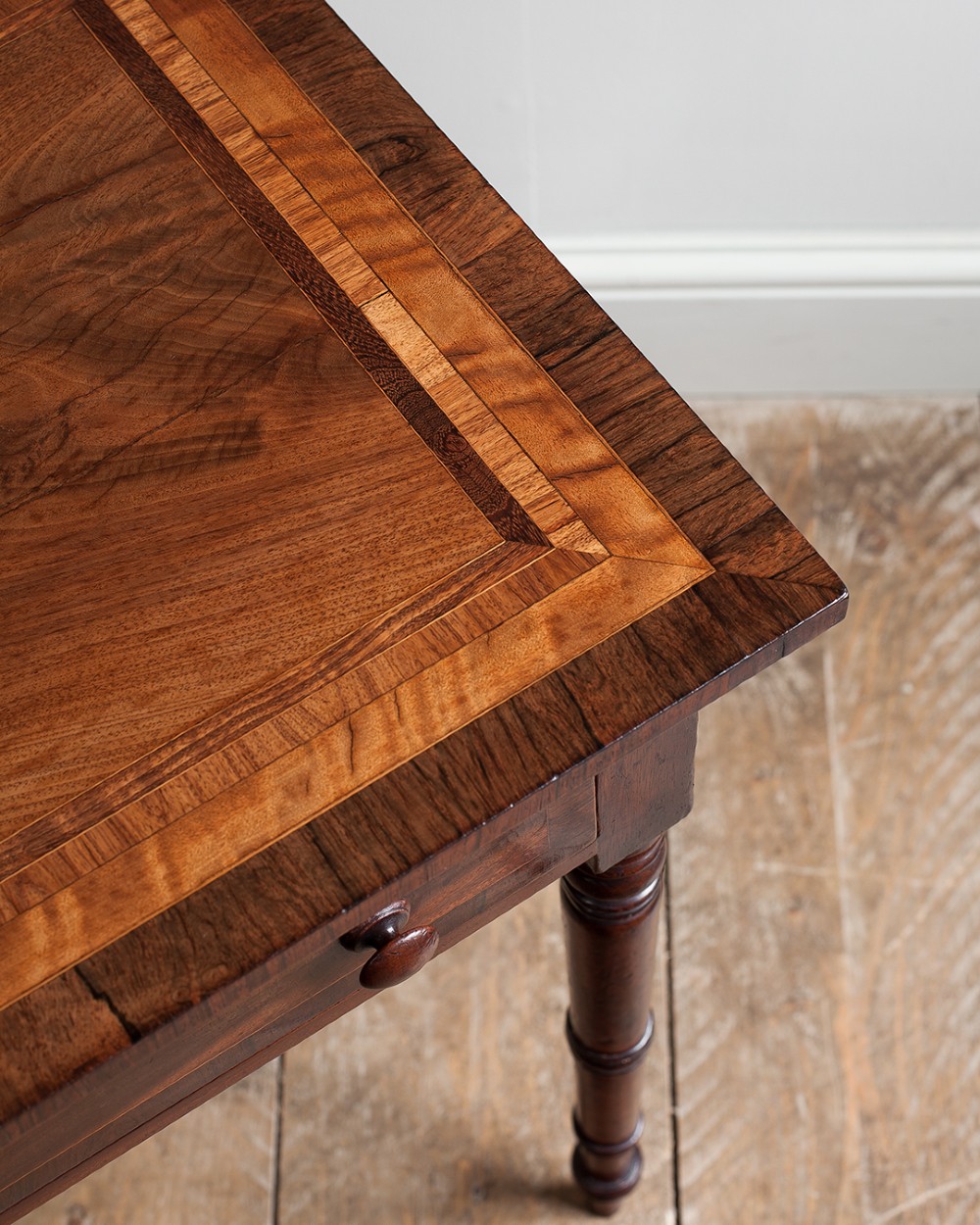 A small George IV mahogany side table featuring a single drawer with wooden knobs and slender turned legs. View IV