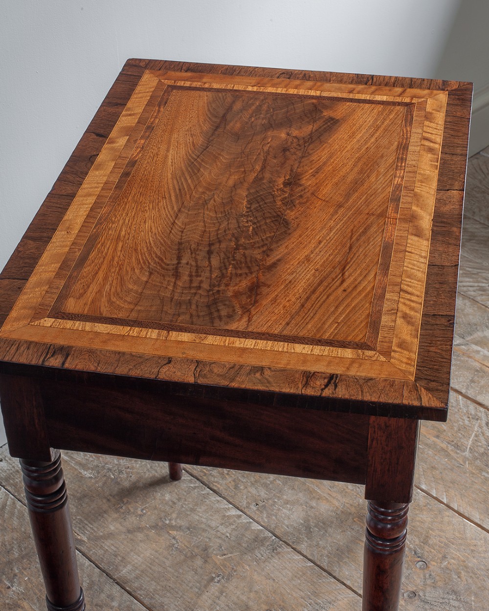 A small George IV mahogany side table featuring a single drawer with wooden knobs and slender turned legs. View V