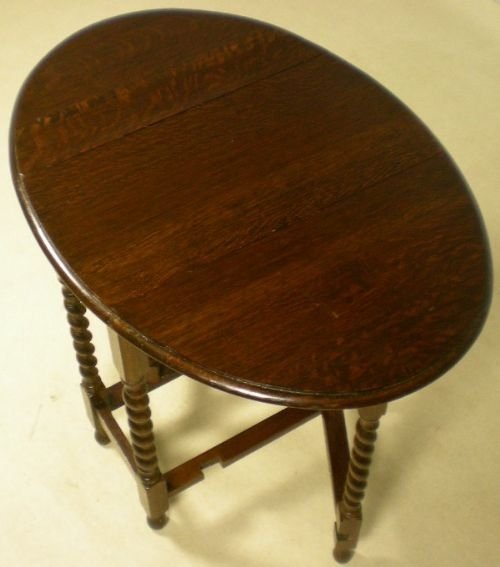 A Small Oval Dark Oak Gateleg Table