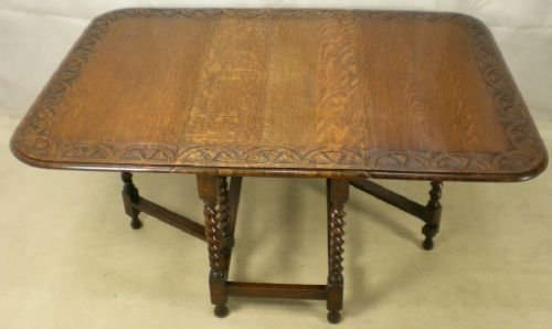 A Carved Oak Gateleg Dining Table to Seat Six

