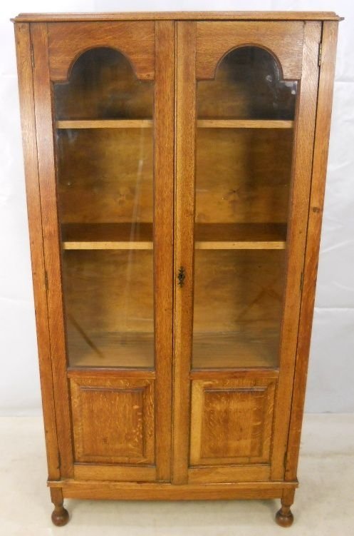Tall Light Oak Two Door Bookcase Cabinet