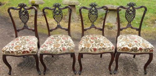 Set of Four Edwardian Carved Mahogany Salon Chairs