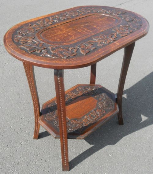 Edwardian Carved Oak Oval Two Tier Occasional Table