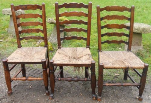 Three Victorian Elm Ladderback Dining Chairs