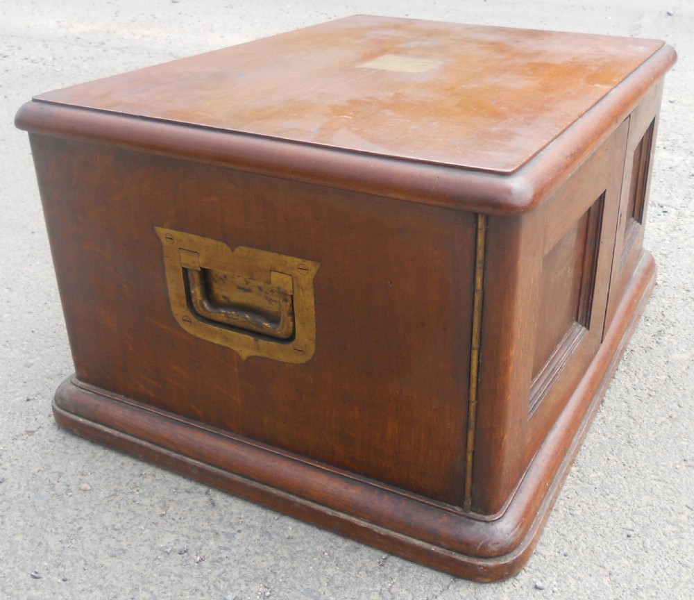 A large Victorian mahogany cutlery box featuring twin front panel doors, brass side handles, and a top brass plaque. View III