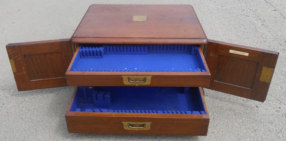 A large Victorian mahogany cutlery box featuring twin front panel doors, brass side handles, and a top brass plaque. View XI