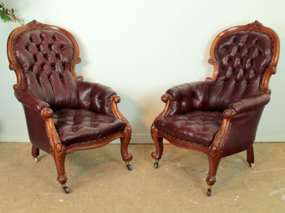 A pair of Victorian Mahogany & Burgundy Leather Library Armchairs
