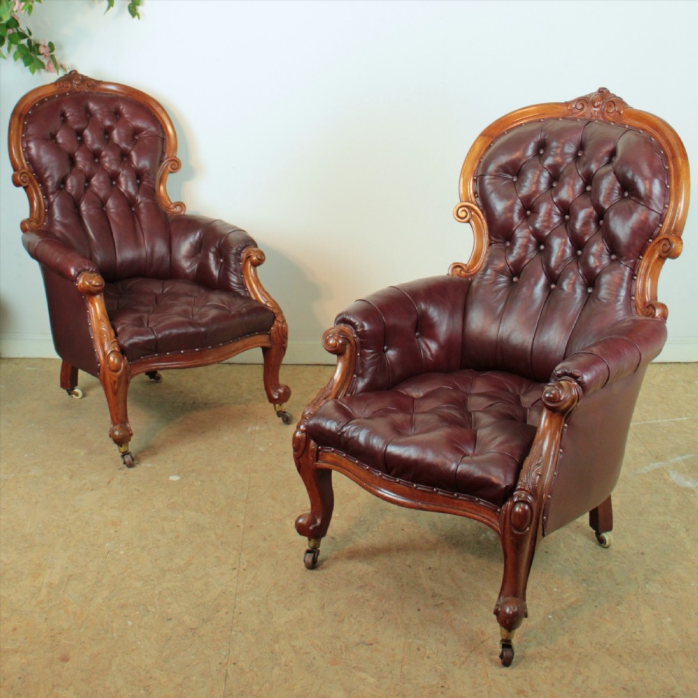A pair of Victorian Mahogany & Burgundy Leather Library Armchairs View VI