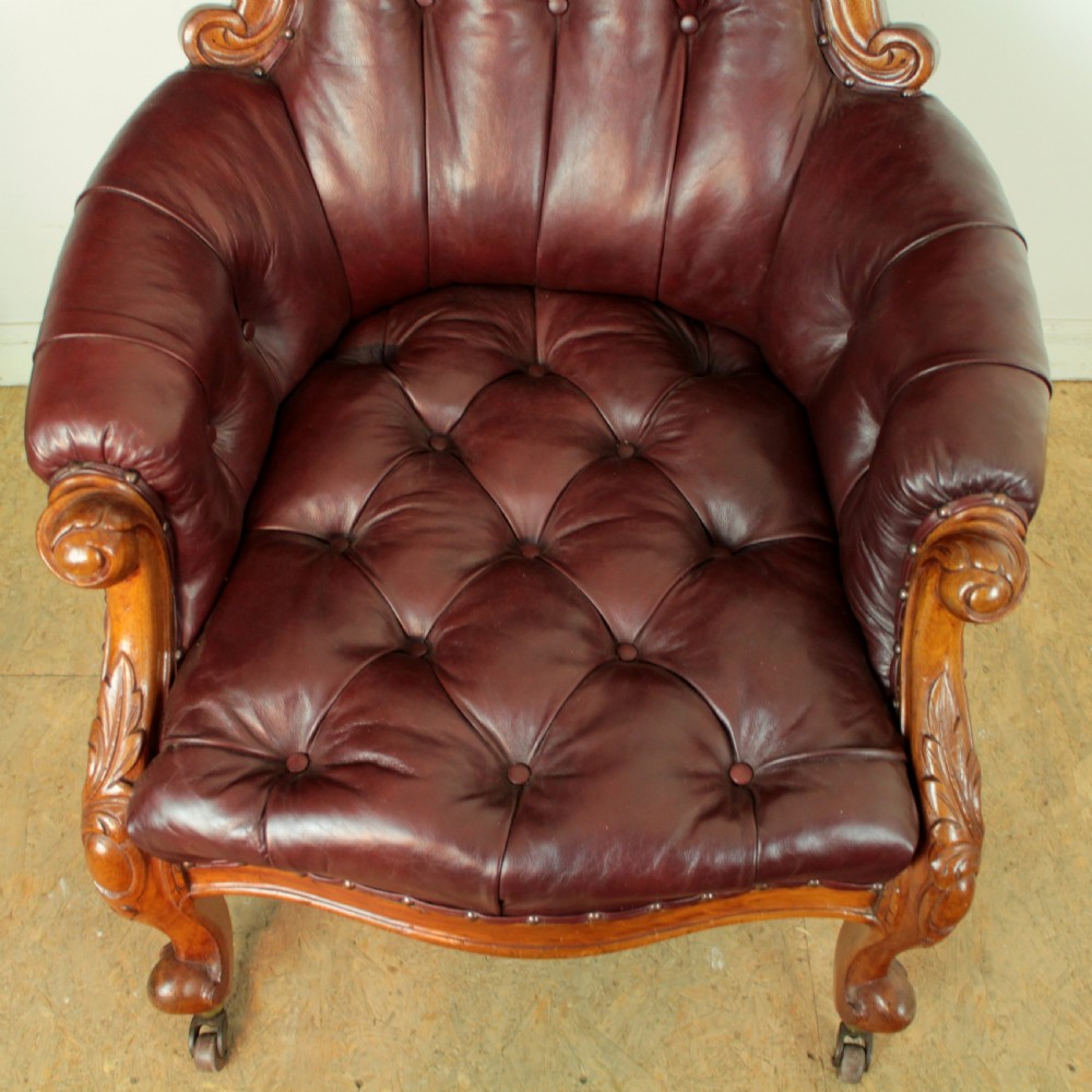 A pair of Victorian Mahogany & Burgundy Leather Library Armchairs View VII