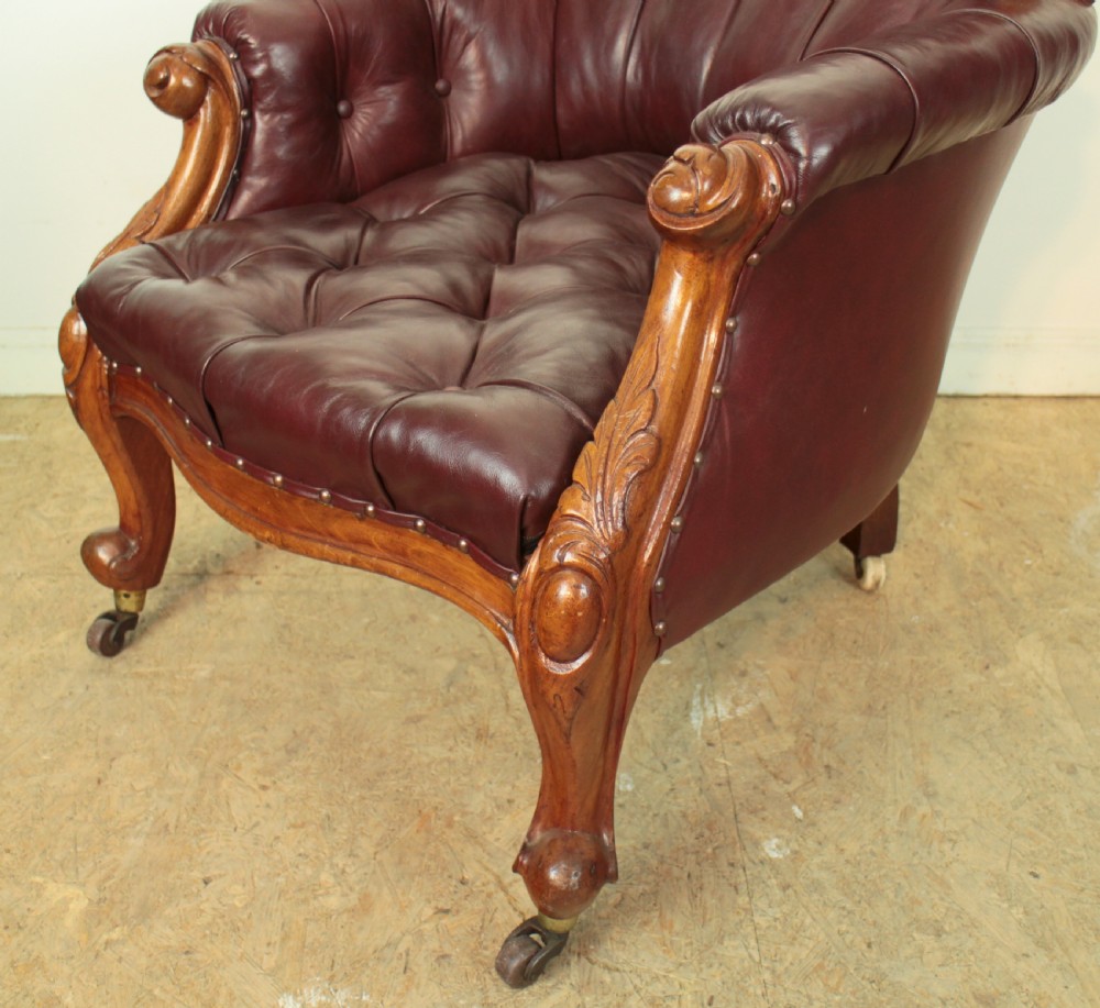A pair of Victorian Mahogany & Burgundy Leather Library Armchairs View VIII
