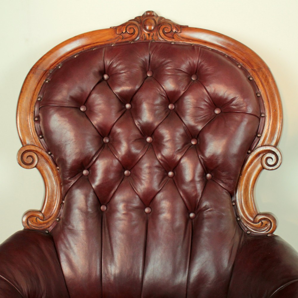 A pair of Victorian Mahogany & Burgundy Leather Library Armchairs View XI