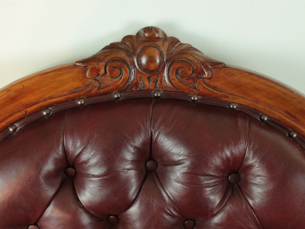 A pair of Victorian Mahogany & Burgundy Leather Library Armchairs View XII