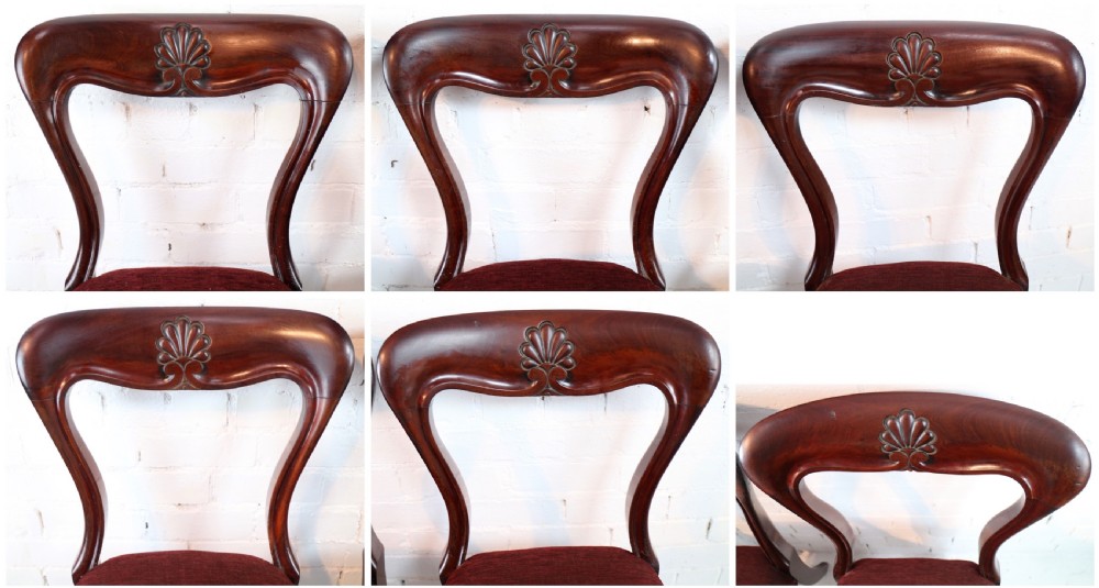 A set of ten William IV mahogany dining chairs with carved top rails, turned front legs, and deep red upholstery. View XXI