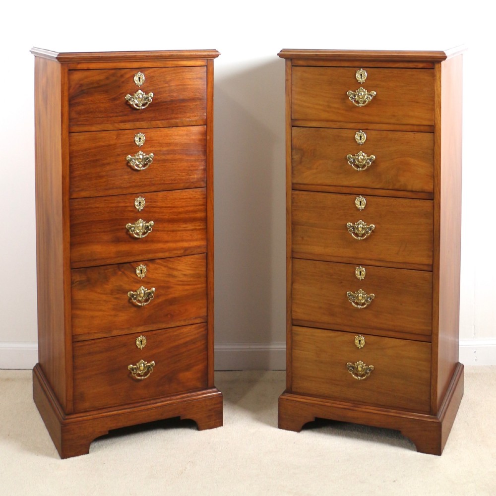 A pair of tall Scottish Late Victorian mahogany collectors chests with five drawers each, featuring brass drop handles and escutcheons. View II