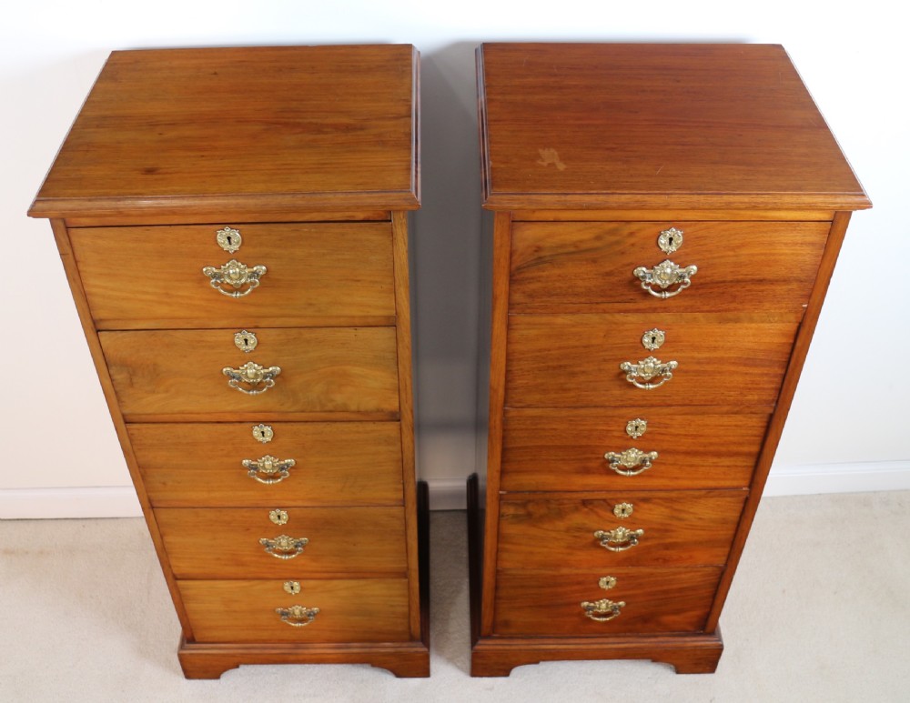 A pair of tall Scottish Late Victorian mahogany collectors chests with five drawers each, featuring brass drop handles and escutcheons. View III