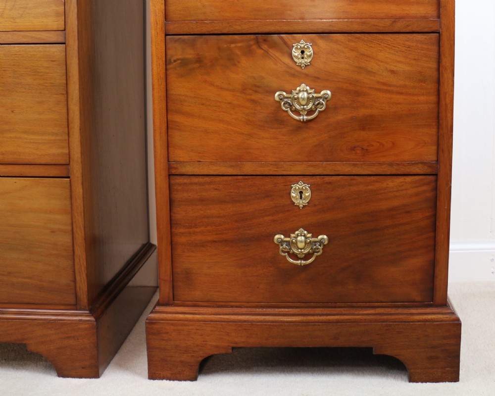 A pair of tall Scottish Late Victorian mahogany collectors chests with five drawers each, featuring brass drop handles and escutcheons. View IX