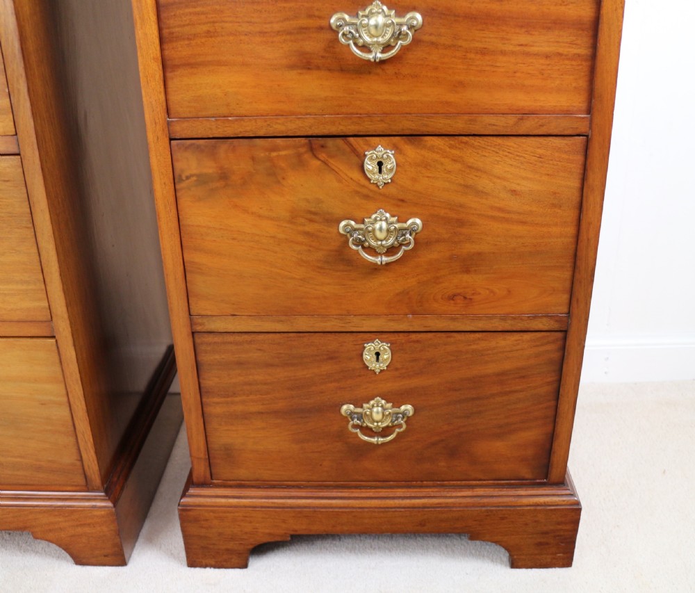A pair of tall Scottish Late Victorian mahogany collectors chests with five drawers each, featuring brass drop handles and escutcheons. View XVII