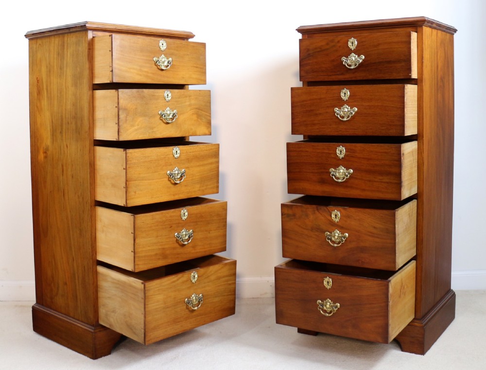 A pair of tall Scottish Late Victorian mahogany collectors chests with five drawers each, featuring brass drop handles and escutcheons. View XIX