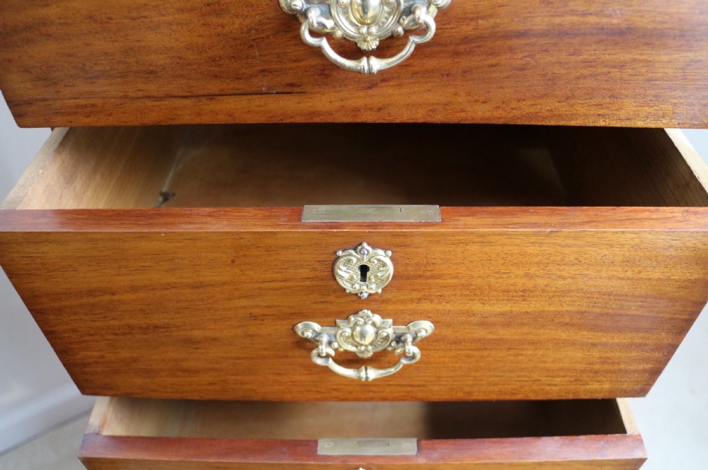 A pair of tall Scottish Late Victorian mahogany collectors chests with five drawers each, featuring brass drop handles and escutcheons. View XXII