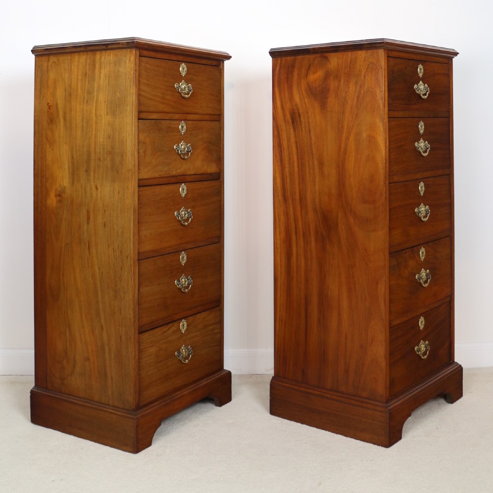 A pair of tall Scottish Late Victorian mahogany collectors chests with five drawers each, featuring brass drop handles and escutcheons. View XXVII