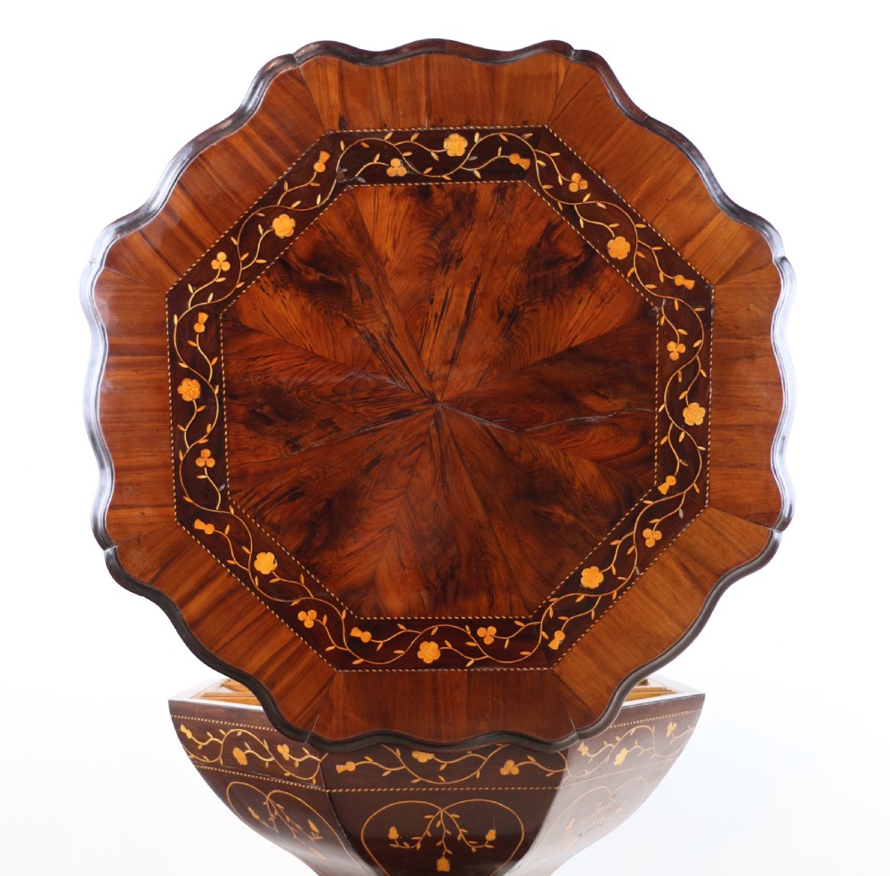 A Victorian Killarney Ware arbutus wood work table with a hinged scalloped top featuring shamrock marquetry on a faceted trumpet pedestal. View V