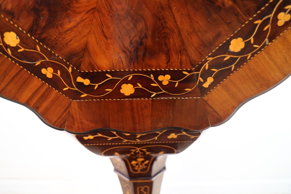A Victorian Killarney Ware arbutus wood work table with a hinged scalloped top featuring shamrock marquetry on a faceted trumpet pedestal. View X