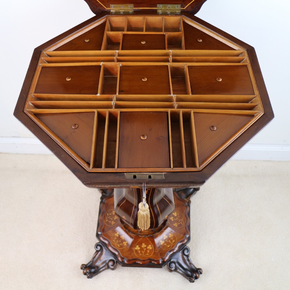 A Victorian Killarney Ware arbutus wood work table with a hinged scalloped top featuring shamrock marquetry on a faceted trumpet pedestal. View XIX