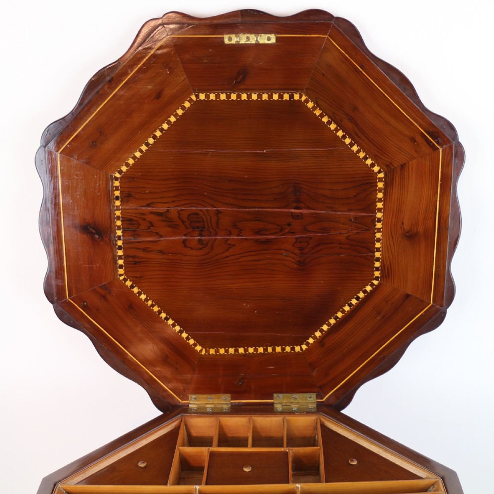 A Victorian Killarney Ware arbutus wood work table with a hinged scalloped top featuring shamrock marquetry on a faceted trumpet pedestal. View XXXI