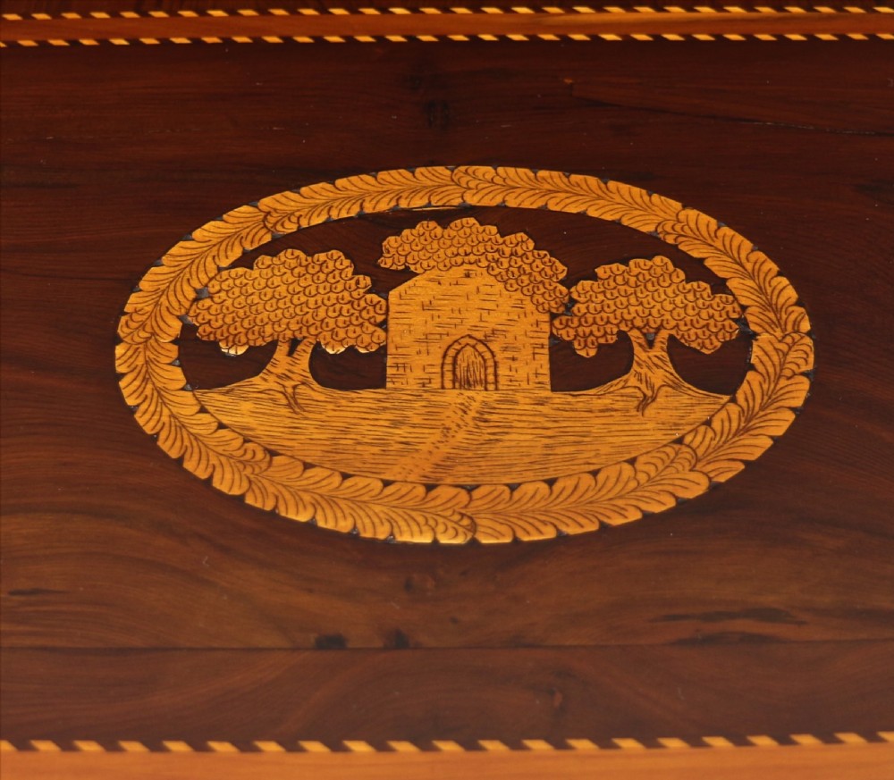 A set of three nested wooden side tables featuring detailed marquetry inlays of foliage and central vignettes, supported by slender turned legs and scroll feet. View XV