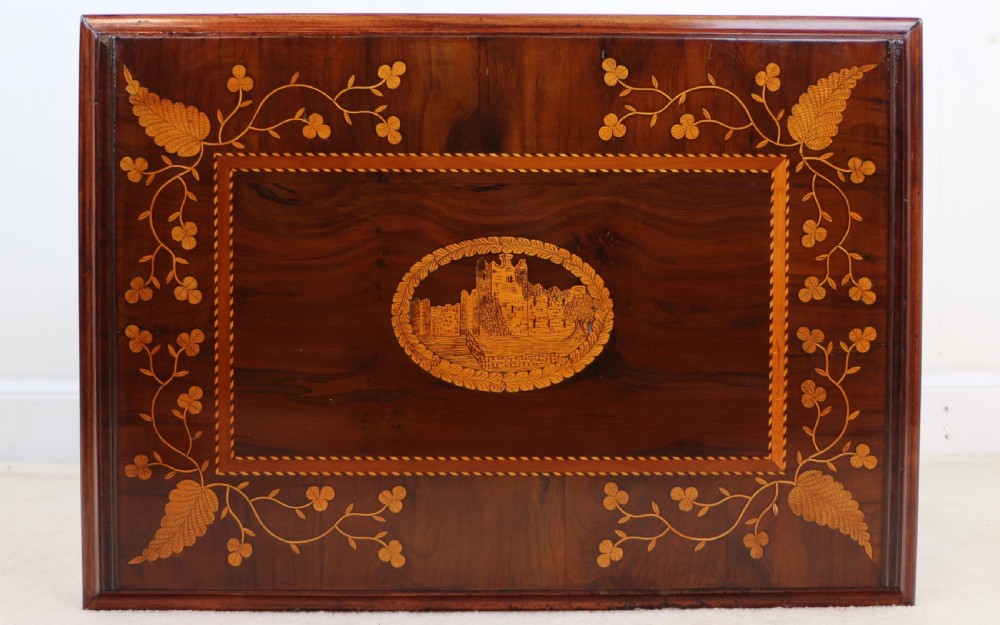 A set of three nested wooden side tables featuring detailed marquetry inlays of foliage and central vignettes, supported by slender turned legs and scroll feet. View XVIII