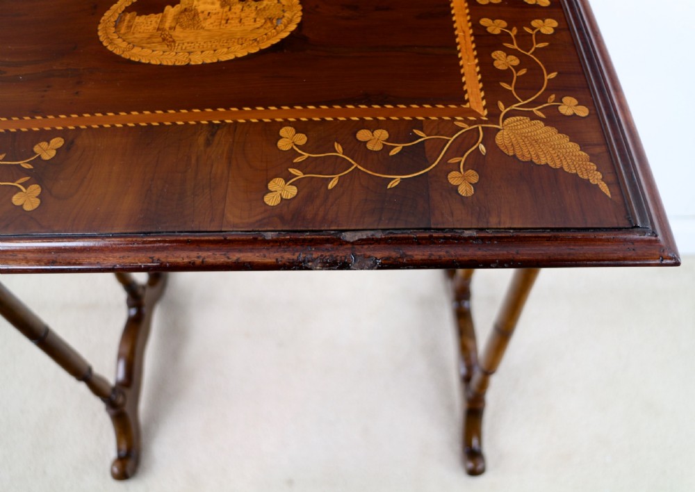A set of three nested wooden side tables featuring detailed marquetry inlays of foliage and central vignettes, supported by slender turned legs and scroll feet. View XXV