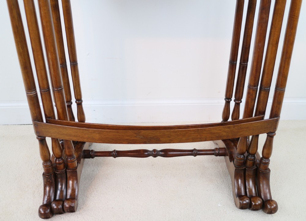 A set of three nested wooden side tables featuring detailed marquetry inlays of foliage and central vignettes, supported by slender turned legs and scroll feet. View XXVII